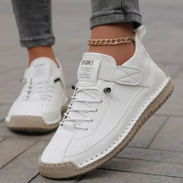 Clover comfort sneakers worn on the feet with casual trousers